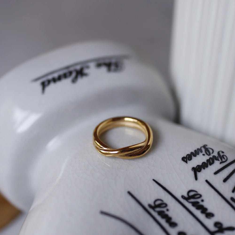 R070 stainless simple twist ring