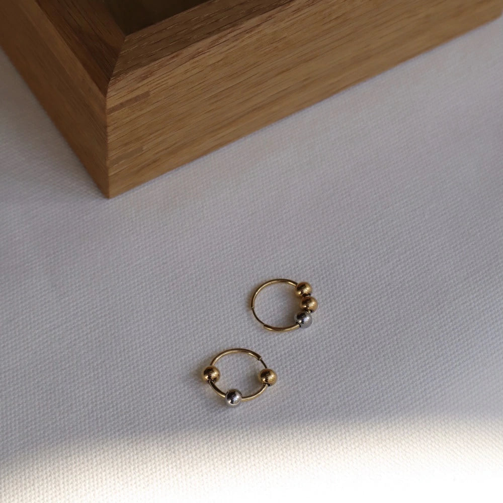 P407 stainless bi-color ball hoop pierce