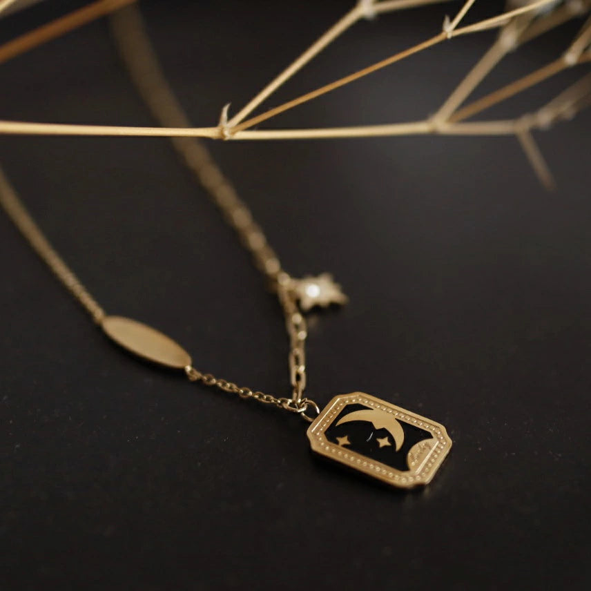 N033 stainless moon flame pendant