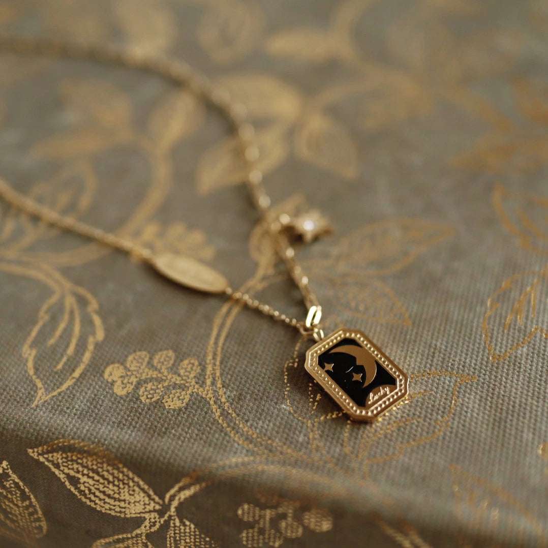 N033 stainless moon flame pendant
