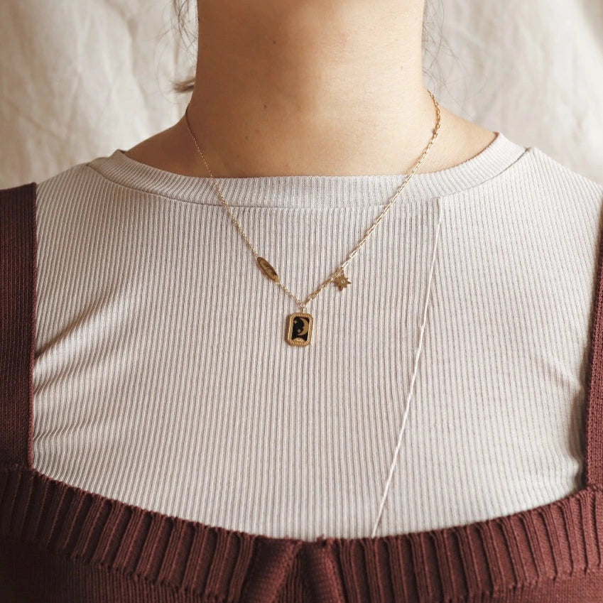 N033 stainless moon flame pendant