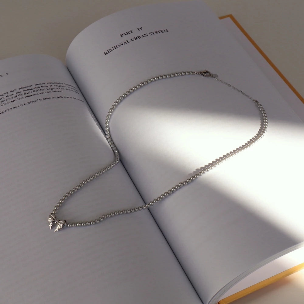N239 stainless silver ribbon pearl necklace