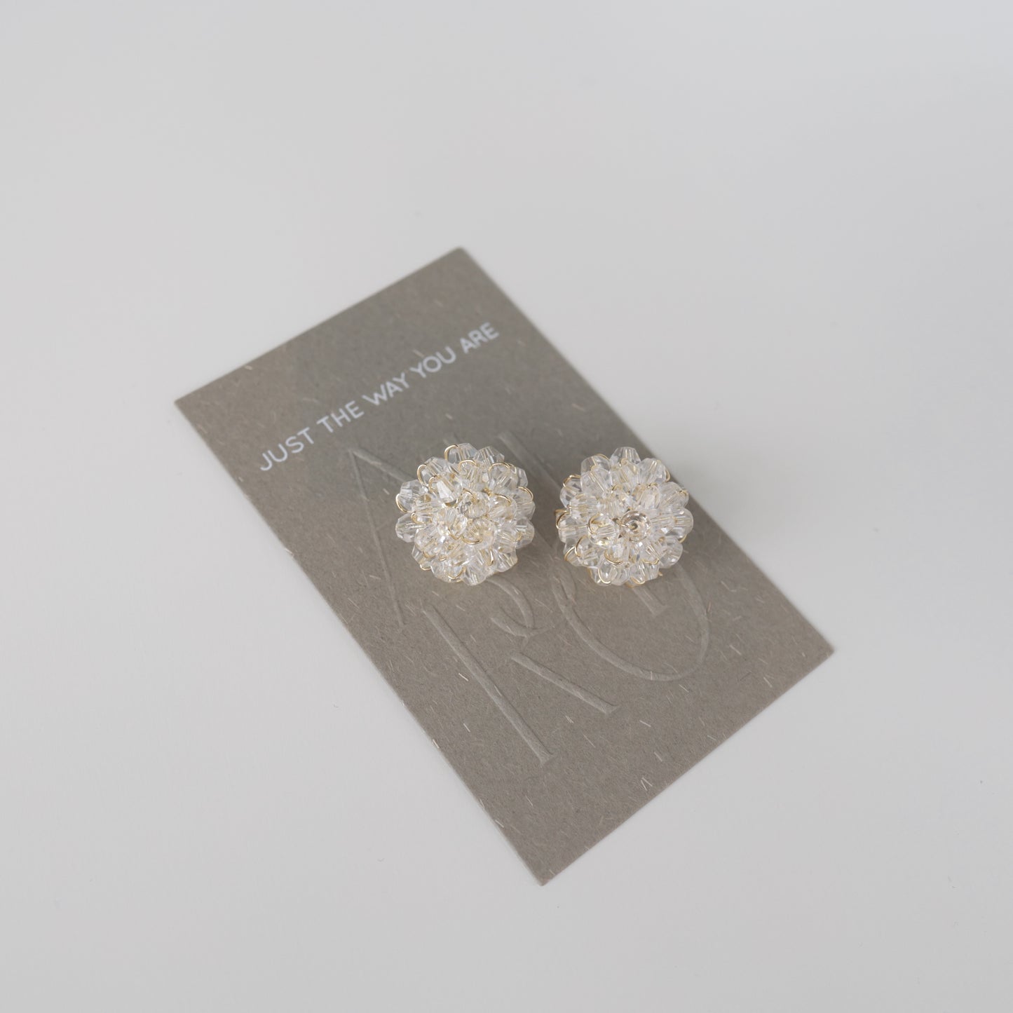 P209 clear flower bead pierce