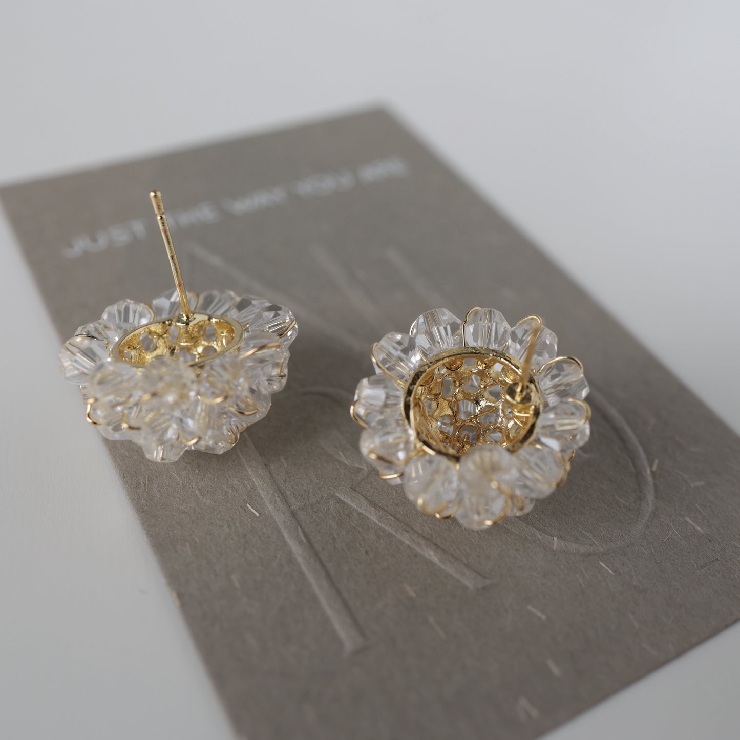 P209 clear flower bead pierce