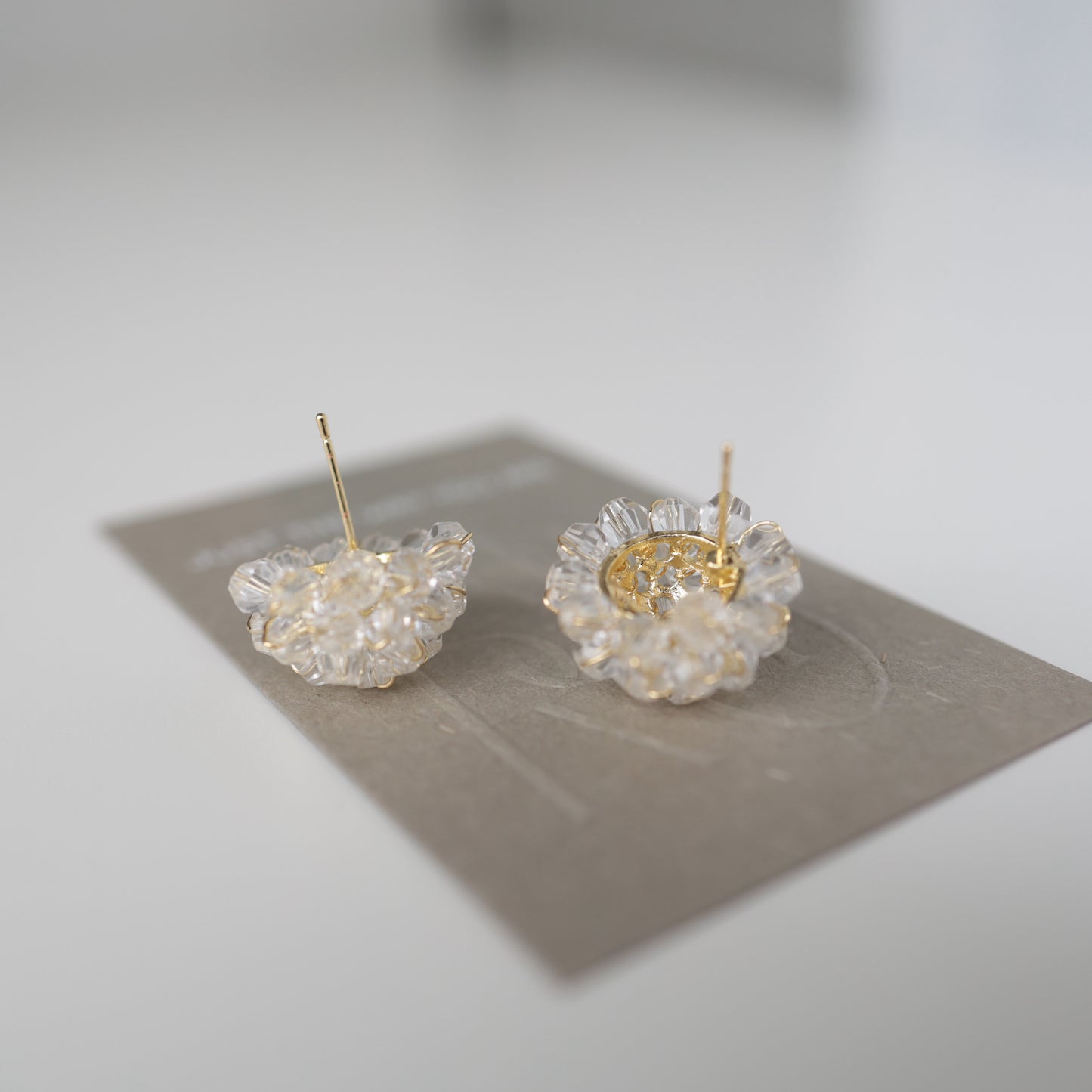 P209 clear flower bead pierce