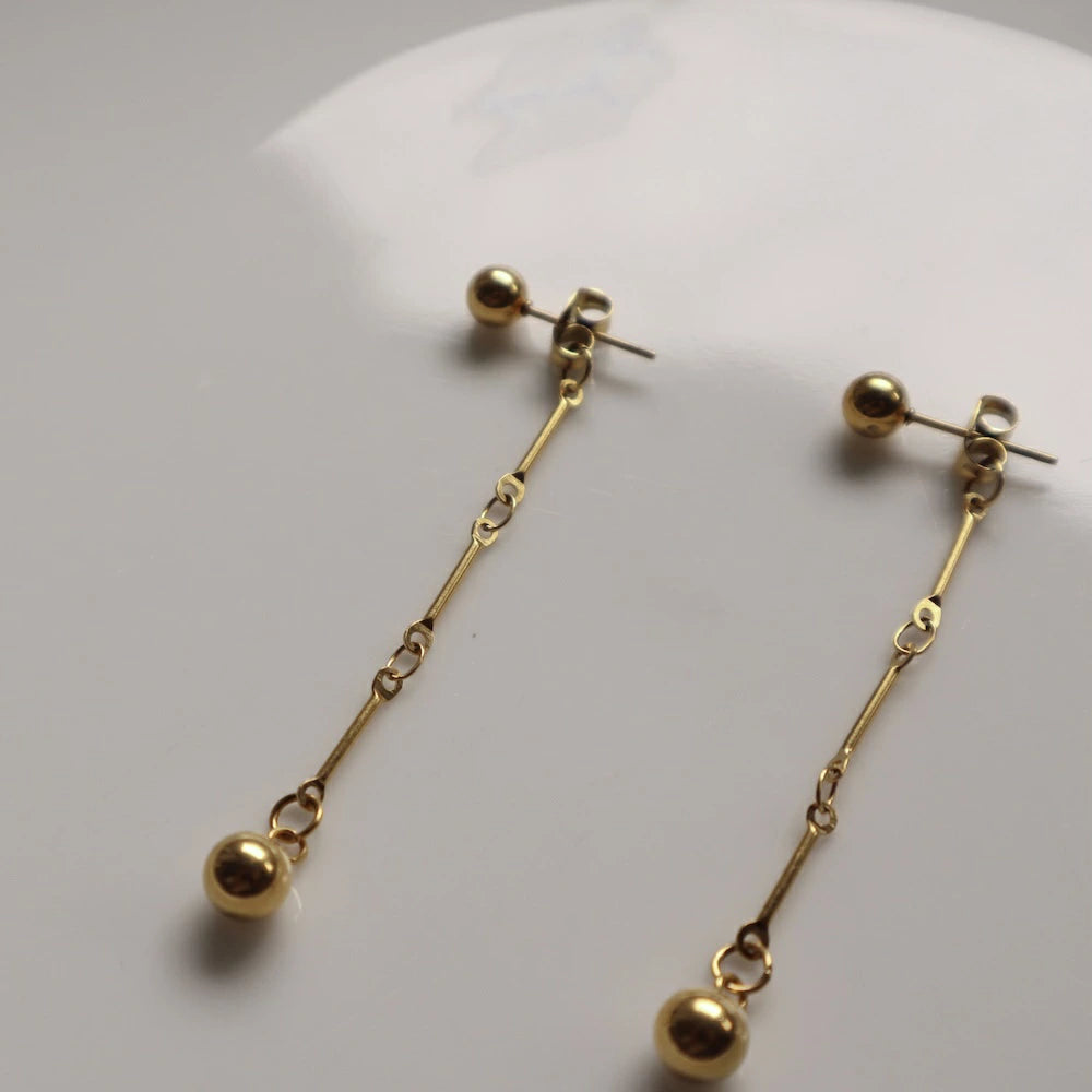 P279  stainless gold ball long chain pierce