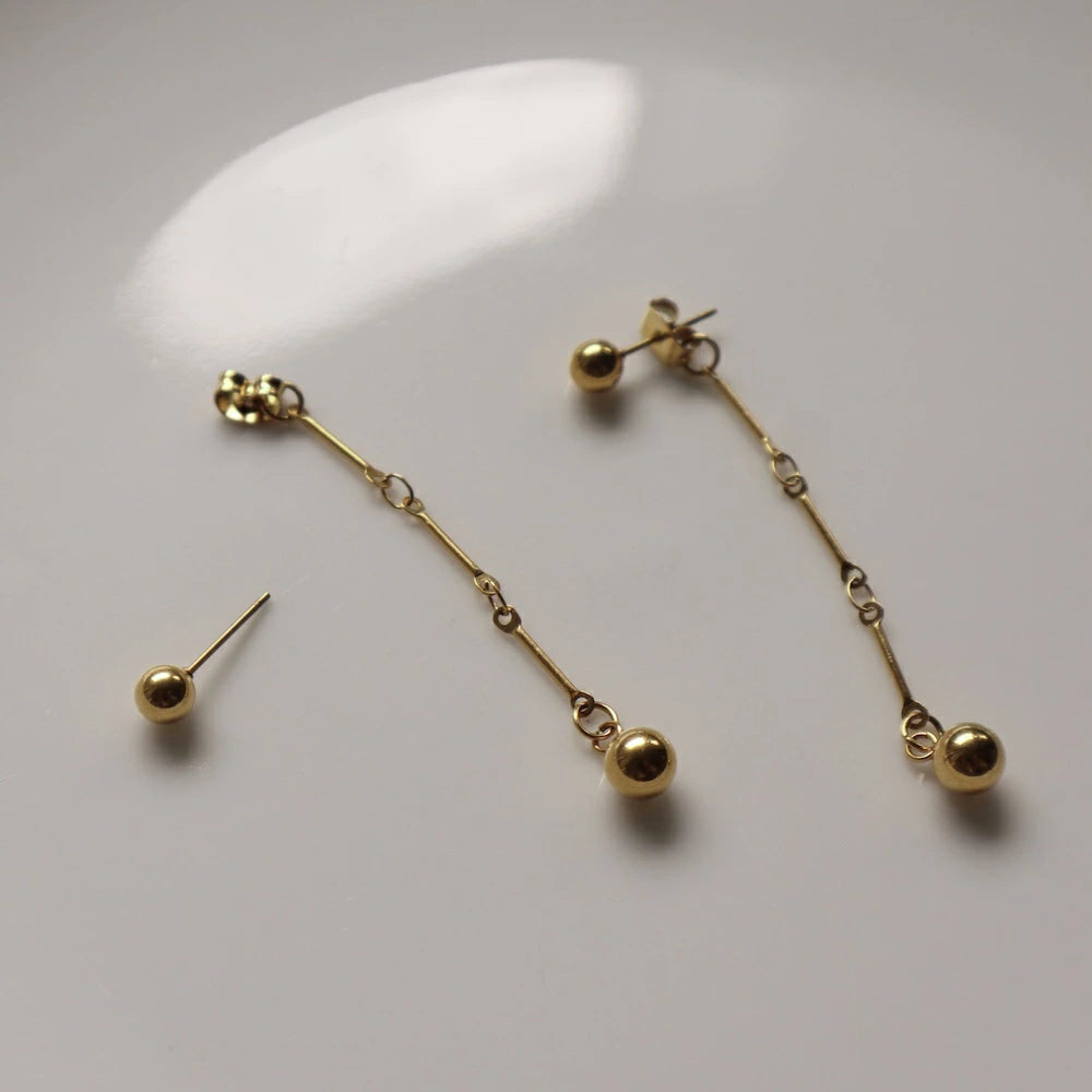 P279  stainless gold ball long chain pierce