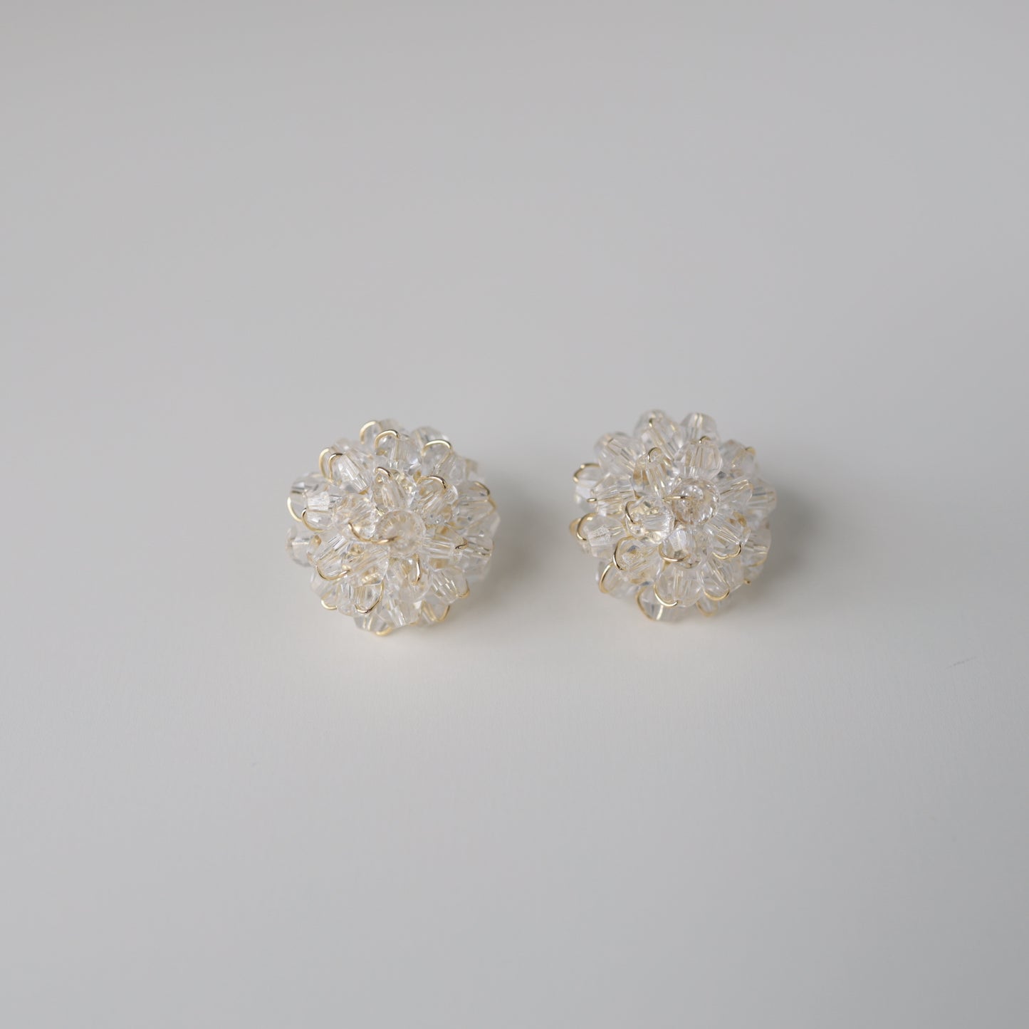 P209 clear flower bead pierce
